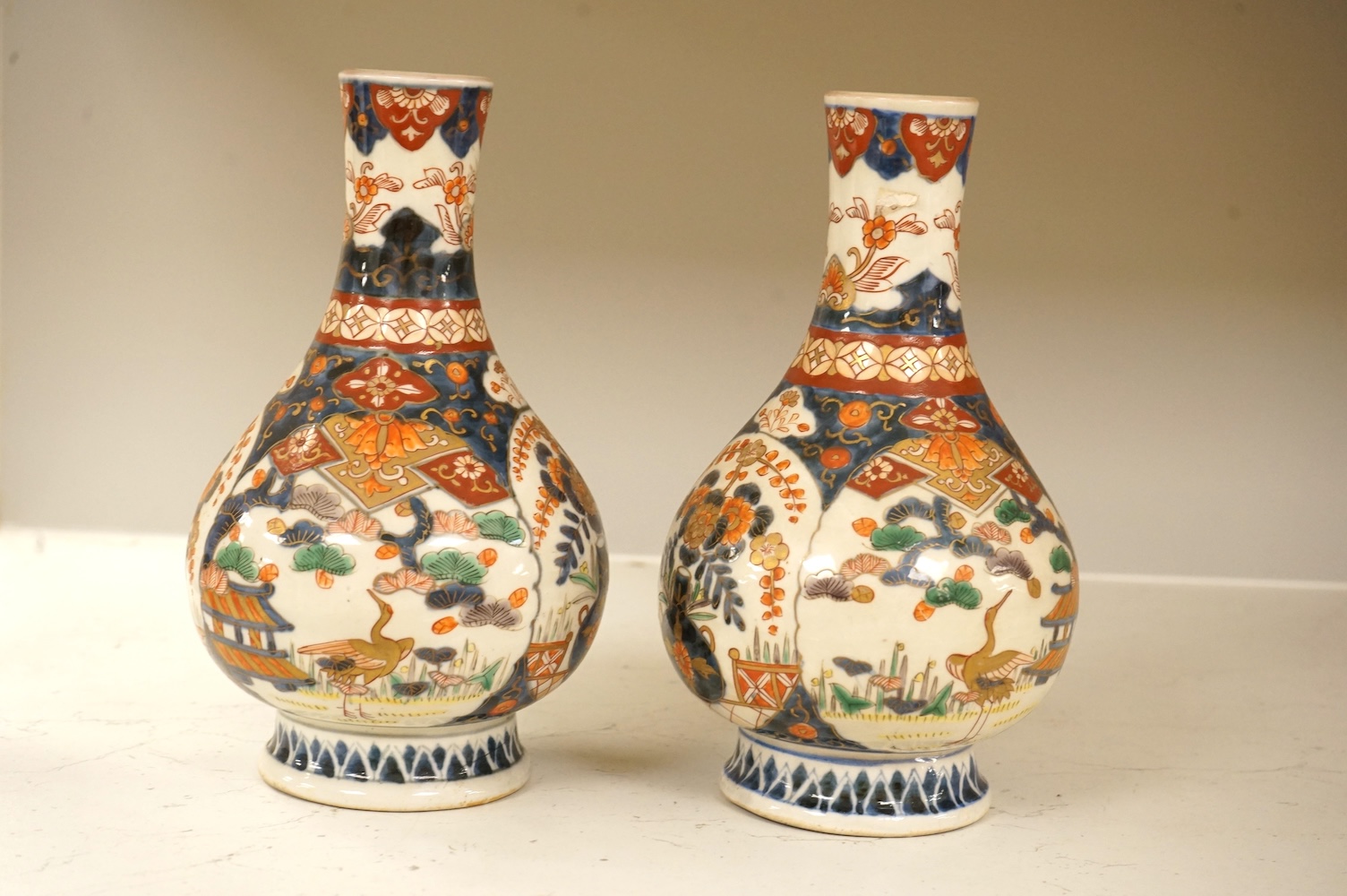 A pair of 19th century Japanese Imari bottle vases, 22cm high